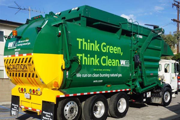 Waste Management truck with the slogan "Think Green and Think Clean"